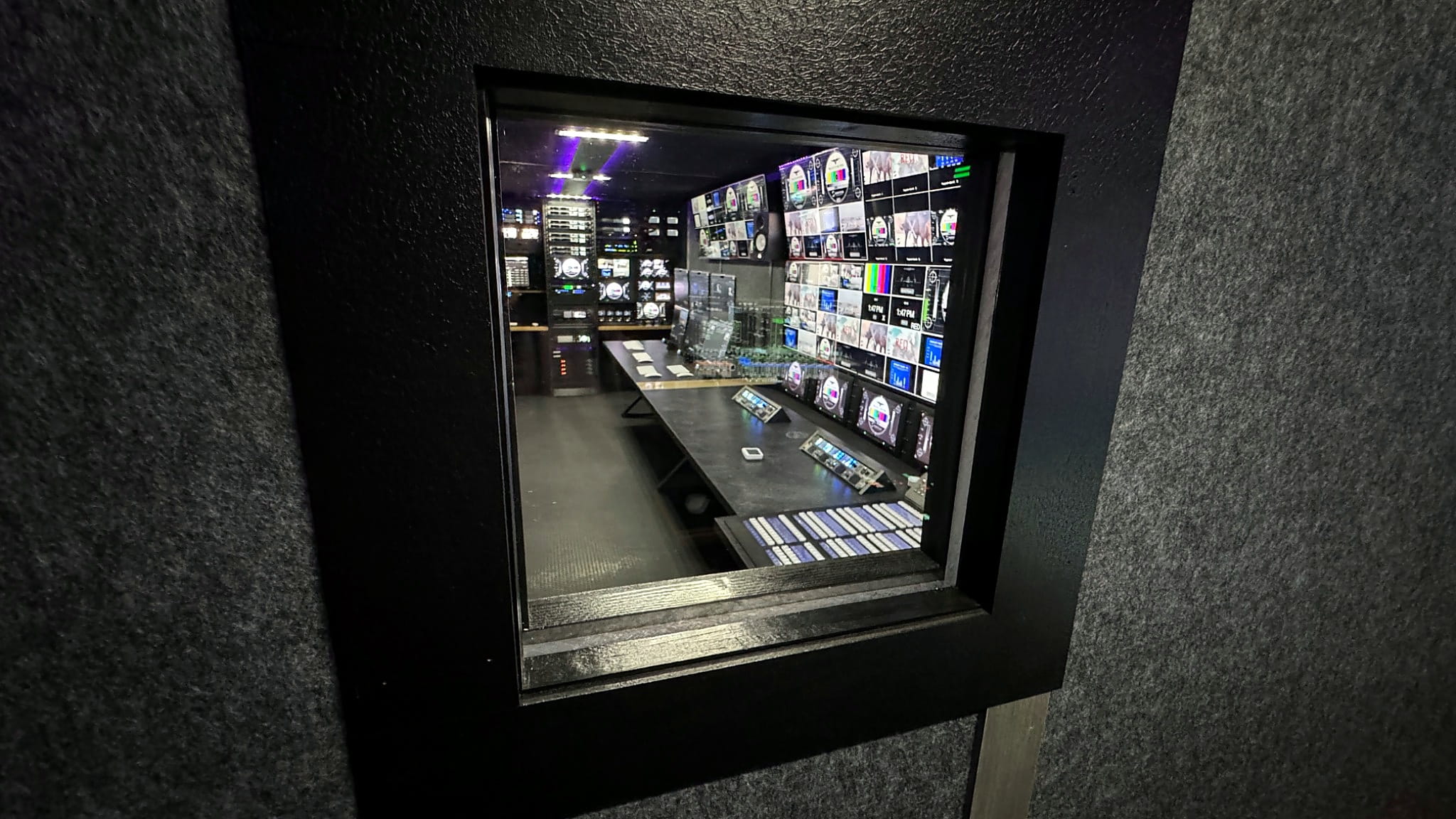 View from the audio room into production control